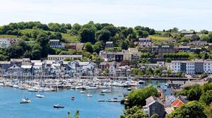 The contemporary waterfront of Kinsale is on reclaimed land along the original uneven and marshy shore. The houses on the south side of the main street had their backs to the sea, and Kinsale YC (on the extreme left) is a mixture of old and new, with the modern south-facing part of the building, looking towards KYC marina, added to the back of a handsome town house which faces north away from the harbour. - 2015 ICRA Nationals and Sovereign's Cup photo copyright www.afloat.ie taken at  and featuring the  class