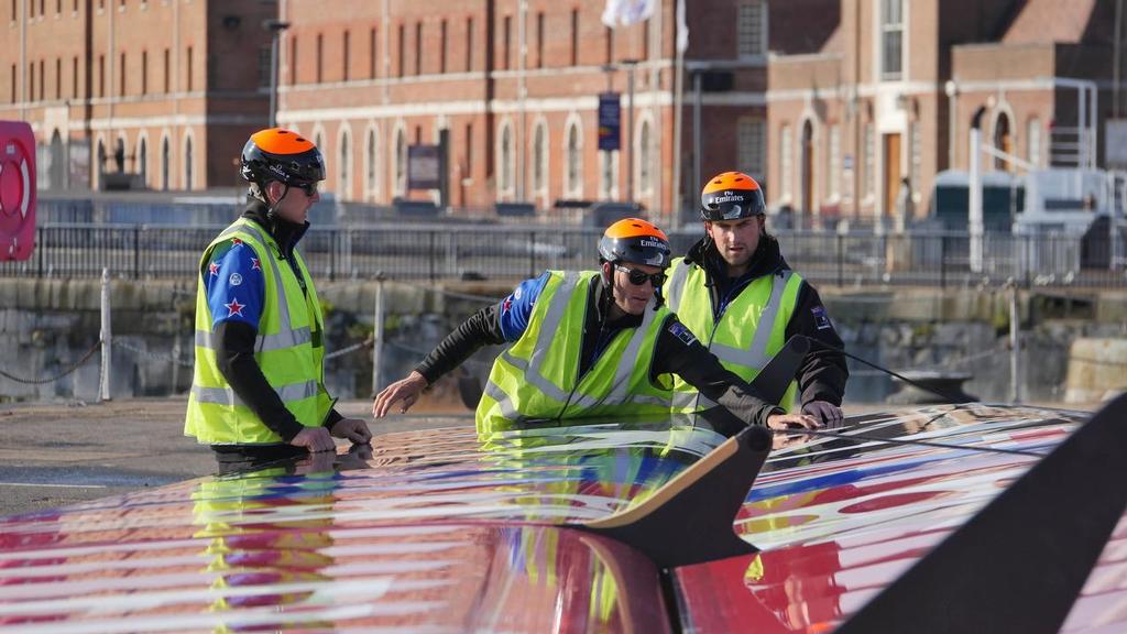 Helmsman Peter Burling, Trimmer Blair Tuke and grinder Guy Endean prepare the boat before sailing on race day one at the Louis Vuitton America's Cup World Series event in Portsmouth, UK &copy; Hamish Hooper/Emirates Team NZ http://www.etnzblog.com