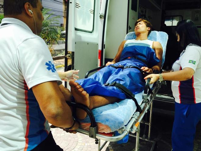 RS:X Windsurfer, Wonwoo Cho (KOR) being loaded into an ambulance prior to being hospitalised © SW