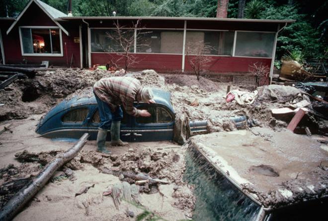 A car was buried in a mudslide possibly triggered by rain related to an El Niño pattern in January 1982.  While an El Niño can bring rain to California, it may not bring a lot of snow. © Jim Sugar