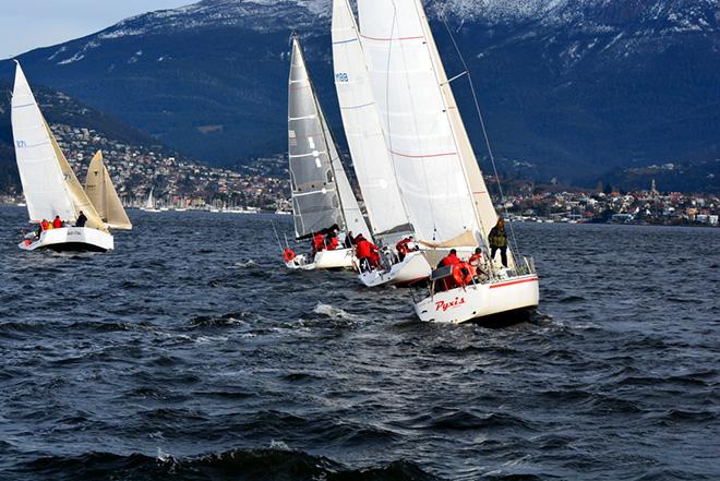 BYC Division 2 fleet heading across the Derwent towards a snow-capped mountain. © Peter Watson