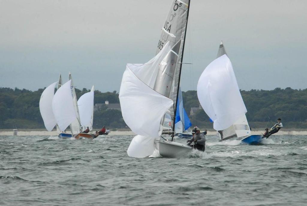 Craig Thompson (helm) and Mike Curtin (crew) douse the chute ahead of the fleet. © Jerry Woelfel