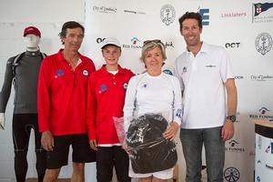 The Royal Hong Kong Yacht Club team collecting the day's prizes courtesy of sponsor Zhik photo copyright Emma Louise Wyn Jones Photography taken at  and featuring the  class