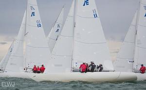 Jamie Clarke of the organising club calls “starboard!” on the fleet, just 50 metres from the pin end of the finishing line. photo copyright Emma Louise Wyn Jones Photography taken at  and featuring the  class