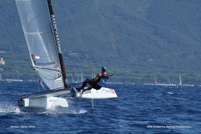 Mischa Heemskerk leading his fleet by a full four minutes at the top mark on lap one - 2015 A-Class Catamaran World Championships © Gordon Upton