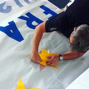 Affixing the Gold Star - Star Sailors League 2015 Lake Neuchatel, Switzerland photo copyright Star Sailors League http://starsailors.com/ taken at  and featuring the  class