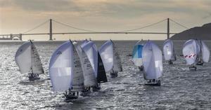 Fleet racing downwind at sunset - 2015 Rolex Farr 40 World Championship photo copyright  Rolex/Daniel Forster http://www.regattanews.com taken at  and featuring the  class