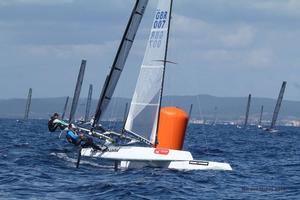 UK sailor Chris Field rounds the top mark, just ahead of barefoot Aussie Jason Waterhouse - 2015 A-Class Catamaran World Championships photo copyright Gordon Upton taken at  and featuring the  class