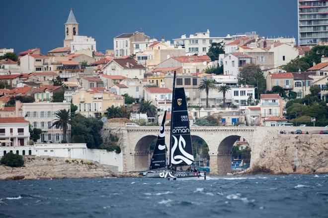 Oman flies in front of Marseille - 2015 Bullitt GC32 Racing Tour &copy; Sander van der Borch / Bullitt GC32 Racing Tour