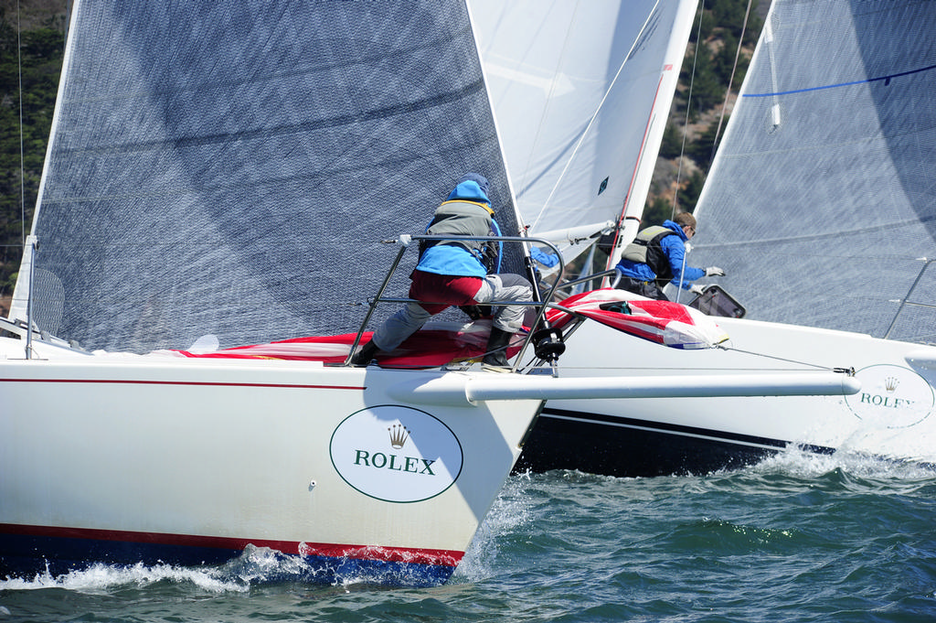 Foredeck crew preparing for launch as they approach the mark outside the Gate. With the ratio of males and females working the pointy ends of race boats rapidly reaching parity, the term 