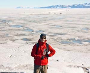 The study's lead author, Luke Trusel, standing in front of sea ice covered in melt ponds in December 2010 outside of McMurdo Station, Antarctica photo copyright Luke Trusel taken at  and featuring the  class