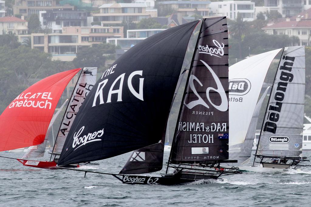 Close racing action just behind the leaders on the first spinnaker run photo copyright Frank Quealey taken at  and featuring the  class