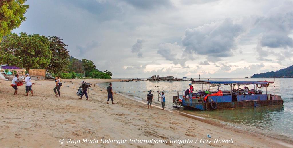 The baggage boat unloads. Raja Muda Selangor International Regatta 2015 photo copyright Guy Nowell / RMSIR taken at  and featuring the  class
