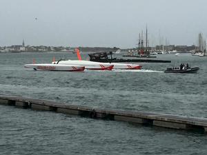 The capsized 80ft Ultime trimaran Prince de Bretagne is towed into port - Vincent Marsaudon photo copyright SW taken at  and featuring the  class