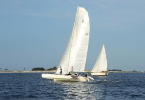 Mike Patterson's Corsair 31R 'Bellafonte' lifts a hull leaving Pensacola pass on the way to Cuba. This has proven to be a wet ride, wetter than expected, for the little tri. Bob Kriegel's Pearson 424 'Acadia' in the background left in there wake. - 2015 Pensacola a la Habana Race photo copyright Talbot Wilson taken at  and featuring the  class