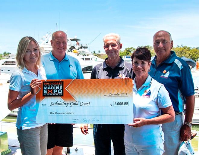 Expo event and marketing manager Emma Brown and Expo chairman Brett Thurley present a $1000 donation to Sailability Gold Coast past president Paul Dinniss, current president Jenny Ponting and past president Peter Board © Gold Coast Marine Expo www.gcmarineexpo.com.au