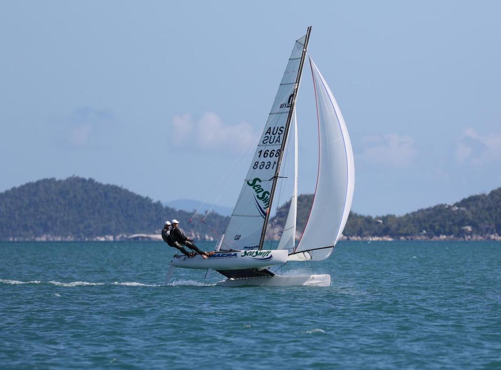 Thomas_Orr_Day 1, F18 'Seaswift' sailed by Adam Beattie and Jamie Leitner from Cairns Sailing Club with Bedarra Island in the background. © Thomas Orr