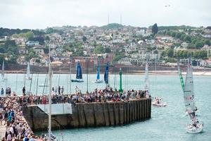 Crowds gather on Torbay Harbour to wave the Solitaire du Figaro fleet on the next leg of the race. - Solitaire du Figaro photo copyright Lloyd Images taken at  and featuring the  class