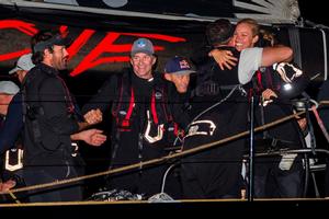 Comanche crew celebrate with co-owner Kristy Clark and skipper Ken Read - Rolex Sydney Hobart Yacht Race photo copyright Rolex / StudioBorlenghi / Stefano Gattini taken at  and featuring the  class