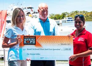 Emma Brown and Brett Thurley present a $1000 donation to Preshni Pillay from Ronald McDonald House Charities – South East Queensland on behalf of the Gold Coast International Marine Expo photo copyright Gold Coast Marine Expo www.gcmarineexpo.com.au taken at  and featuring the  class