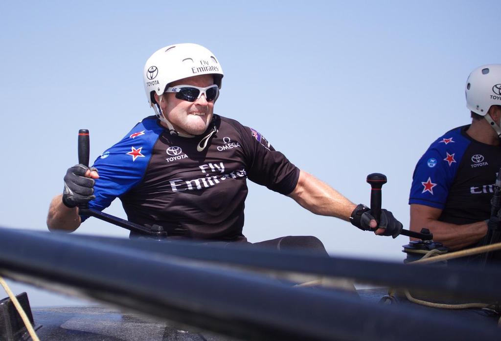 28/2/16 Glenn Ashby grinds on the winch onboard during sailing on race day two of Louis Vuitton America's Cup World Series Oman © Hamish Hooper/Emirates Team NZ http://www.etnzblog.com