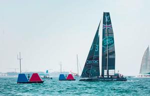 Land Rover BAR cross the finish line (R3) in Muscat - 2016 Louis Vuitton America’s Cup World Series photo copyright  Harry KH / Land Rover BAR taken at  and featuring the  class