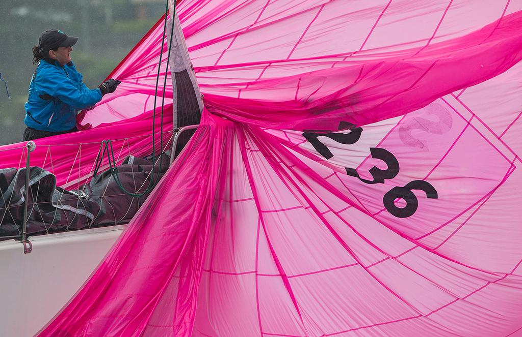 Taking in the kite. © Crosbie Lorimer http://www.crosbielorimer.com