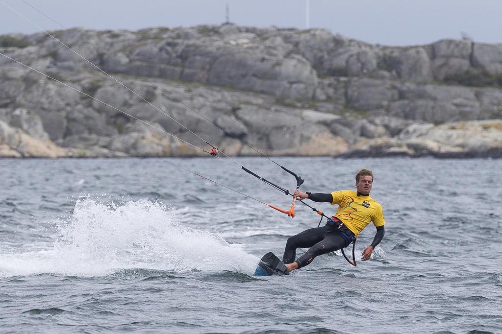 24th June 2015. Gothenburg, Sweden. Kitesurfer Nick Jacobsen jumps from the top of Abu Dhabi Ocean Racing's mast. ©  Ian Roman / Abu Dhabi Ocean Racing