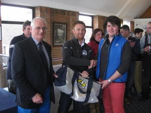 Jack Neale, the winning helm on J/80 Boysterous, in the Academy Frostbite Series receives his prize from Neil 'Jaffa' Harrison, Doyle Sails, and left Commodore Chris Mansfield photo copyright Peta Stuart-Hunt taken at  and featuring the  class
