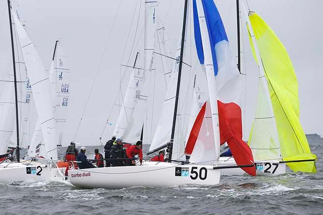 J/70 races commonly see boats rounding marks within a few tenths of a second, as Bodo & Nick von der Wense’s J/70 Turbo Duck shows perfectly at the top mark rounding of Race 2 today. © Tim Wilkes
