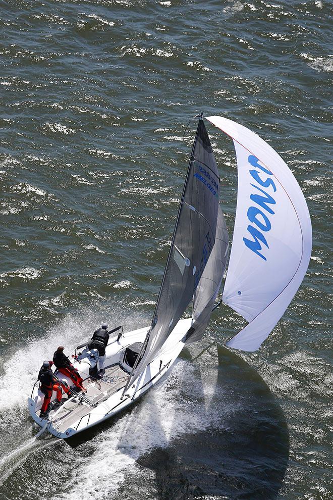 Taking their third consecutive Class victory in the hotly contested Melges 24 fleet, Bruce Ayres' Monsoon team races down a wave © Tim Wilkes
