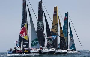The fleet of GC32s look fierce as they charge across the start line on day one of racing in Muscat, Oman. photo copyright Lloyd Images taken at  and featuring the  class
