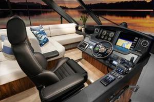State-of-the-art, easy-to-use technology is at the skipper's fingertips from the leather, centre-line helm seat of the Riviera 5400 Sport Yacht. photo copyright Riviera Australia taken at  and featuring the  class