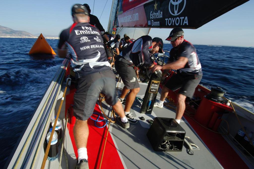 Approaching the bottom mark the spinnaker is pealed onboard Emirates Team New Zealand, NZL82 during a practice race against BMW Oracle Racing, USA76. Louis Vuitton Act 8. Trapani, Sicily, Italy. 28/9/2005 © Chris Cameron www.chriscameron.co.nz