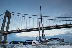 Francois Gabart on board his MACIF ‘Ultim’ 105ft trimaran, shown here celebrating after winning the 'Transat Bakerley' solo transatlantic yacht race. photo copyright Lloyd Images taken at  and featuring the  class