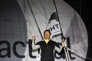 Yves Le Blevec onboard his Actual ‘Ultim’ trimaran, shown here celebrating after finishing 3rd in the solo transatlantic yacht race photo copyright Lloyd Images taken at  and featuring the  class
