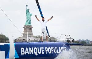 Armel Le Cleac’h onboard his Banque Populaire foiling IMOCA Open60 yacht, shown here celebrating after winning the 'Transat Bakerley' solo transatlantic yacht race photo copyright Lloyd Images taken at  and featuring the  class
