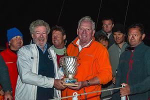 Rambler 88 owner George David receives the Volcano Race line honours trophy from IMA Secretary General Andrew McIrvine. photo copyright Gianluca di Fazio/IMA taken at  and featuring the  class