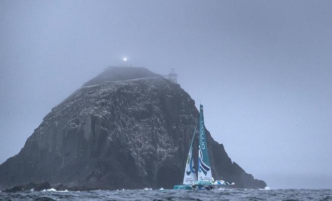 'Musandam' the Sultanate of Oman MOD70 trimaran passing 'Bull Rock' at sunrise this morning. Skippered by Sidney Gavignet (FRA) with team mates Damian Foxall (IRL) and Fahad Al Hasni (OMA), Jean Luc Nelias (FRA), Yasir Al Rahbi (OMA) and Sami Al Sukaili (OMA) - 2016 Volvo Round Ireland Race © Lloyd Images