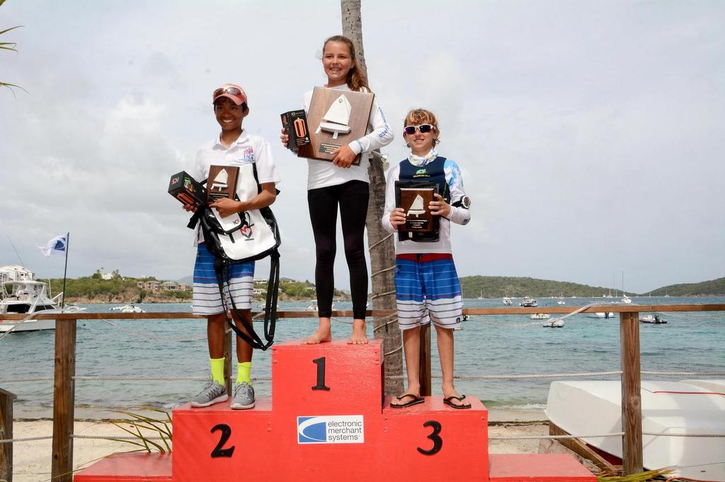 Top Three Overall Winners in the International Optimist Regatta, presented by EMS Virgin Islands, L to R: the USA’s Daven Subbiah (second), USVI’s Mia Nicolosi (first), and USA’s Stephan Baker (third). Credit: Dean Barnes © Dean Barnes
