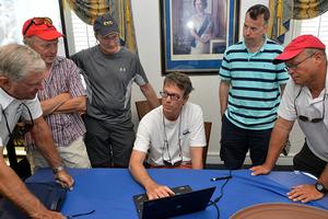 H L Devore, navigator on the St David's Lighthouse trophy winning yacht WARROR WON, shares computer weather and Gulf Stream data with other navigators photo copyright Barry Pickthall / PPL taken at  and featuring the  class