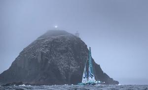'Musandam' the Sultanate of Oman MOD70 trimaran passing 'Bull Rock' at sunrise this morning. Skippered by Sidney Gavignet (FRA) with team mates Damian Foxall (IRL) and Fahad Al Hasni (OMA), Jean Luc Nelias (FRA), Yasir Al Rahbi (OMA) and Sami Al Sukaili (OMA) - 2016 Volvo Round Ireland Race photo copyright Lloyd Images taken at  and featuring the  class