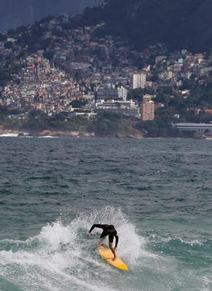 A surfer is seen at Ipanema beach in Rio de Janeiro, Brazil, June 9, 2016. photo copyright Reuters / Sergio Moraes taken at  and featuring the  class