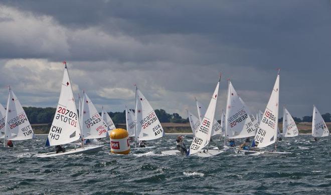 In the meantime, the sun is shining more often across the regatta area at the Laser Youth World Championships. The Swiss Maud Jayet (SUI 199846, on the right) did win one of the three runs on Sunday. © Volker Goebner