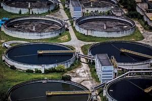 Unused water treatment tanks stand beside working ones. photo copyright Marcia Foletto / Agência O Globo taken at  and featuring the  class