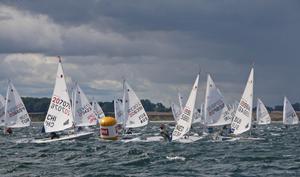 In the meantime, the sun is shining more often across the regatta area at the Laser Youth World Championships. The Swiss Maud Jayet (SUI 199846, on the right) did win one of the three runs on Sunday. photo copyright Volker Goebner taken at  and featuring the  class