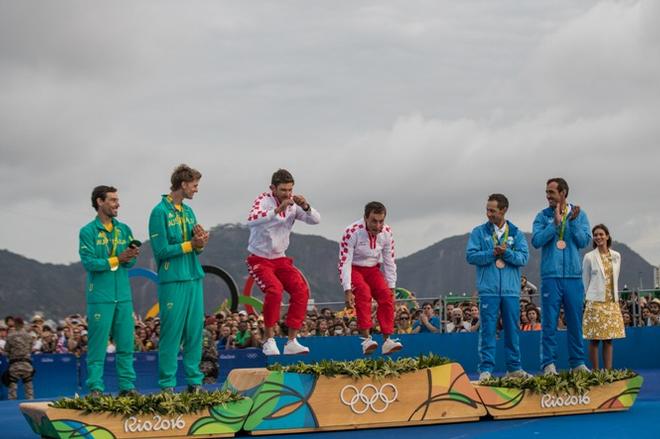 Sime Fantela and Igor Marenic (CRO) arrive on the podium for their gold medals - Rio 2016 Olympic Sailing Competition &copy; Matias Capizzano http://www.capizzano.com
