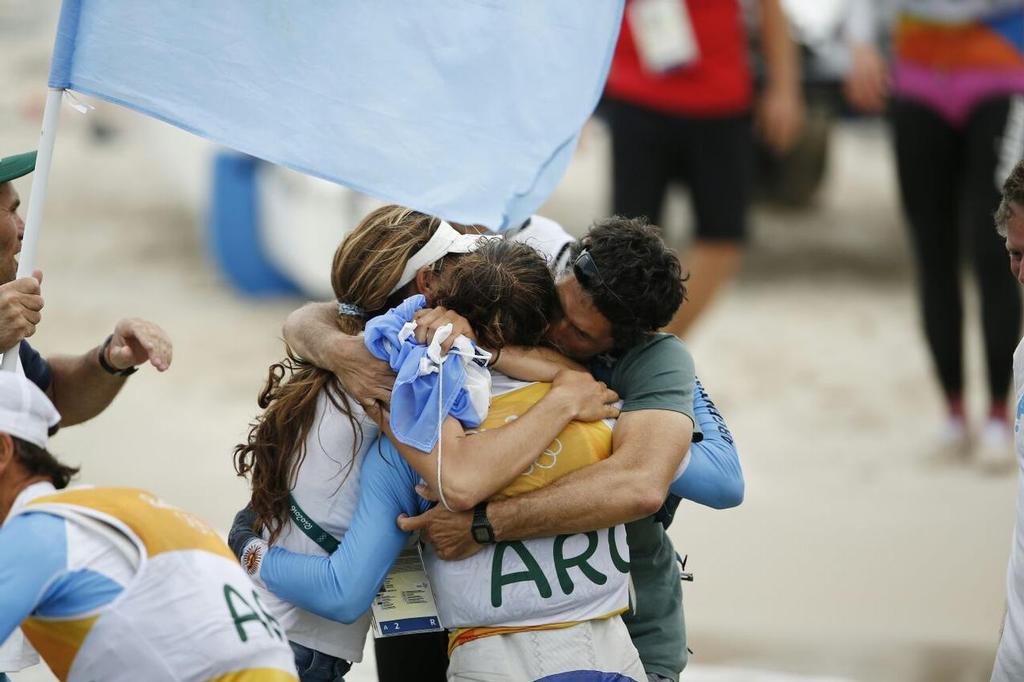 Cecilia Carranza Saroli enjoys the celebrations after winning gold in the Nacra 17 class at the Rio 2016 Olympic Sailing Competition photo copyright Sailing Energy/World Sailing taken at  and featuring the  class