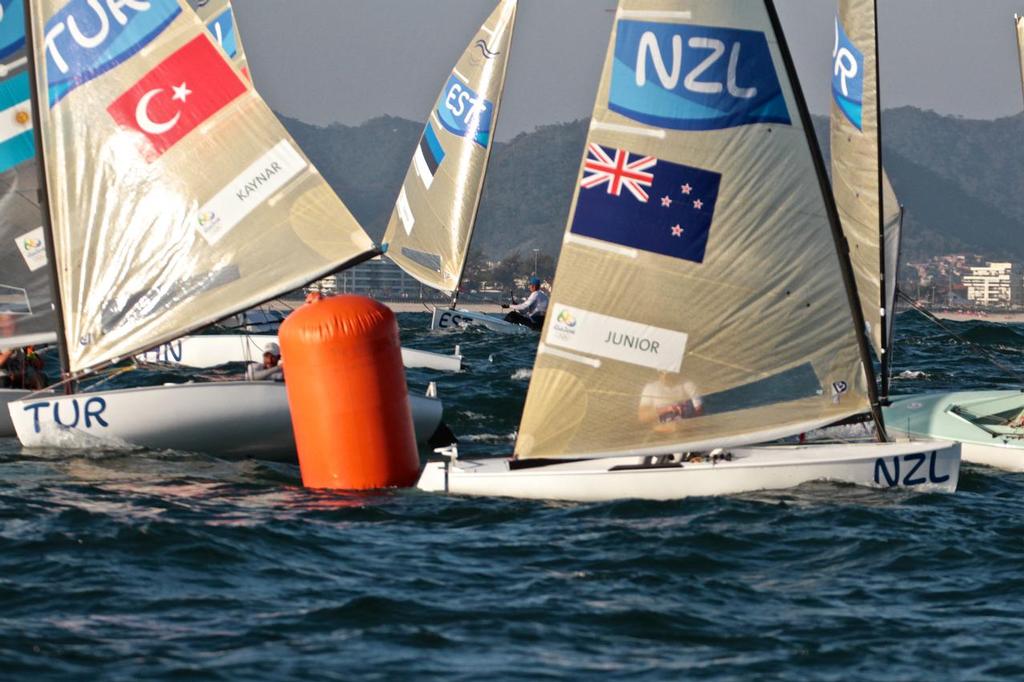 Day 7 - Finn August 14, 2016. Josh Junior (NZ) rounds the leeward mark in heavy traffic in Race 10. photo copyright Richard Gladwell www.photosport.co.nz taken at  and featuring the  class