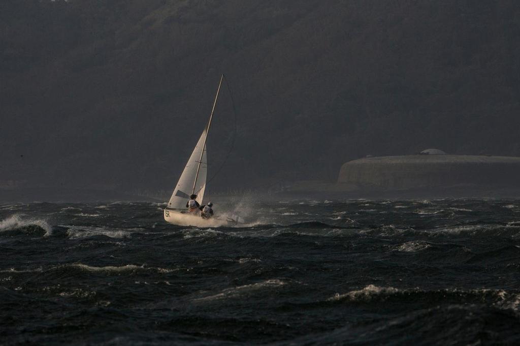 A 470 struggles home after the 49er and 470 fleets were hit by a big squall just after the finish of the final 49er race on Day 8 photo copyright Sailing Energy / World Sailing taken at  and featuring the  class